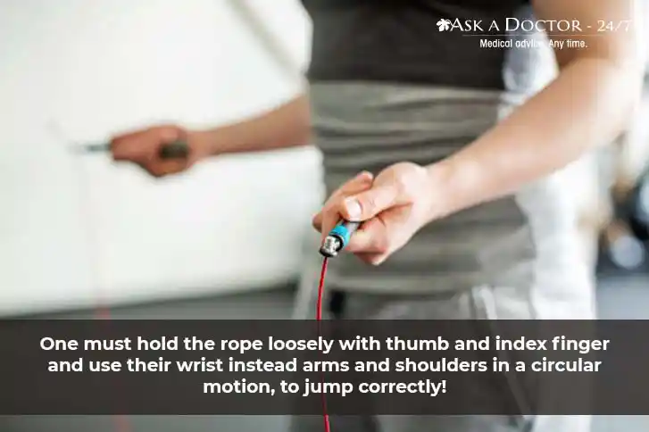  woman holding jump rope firmly with thumb and index finger =